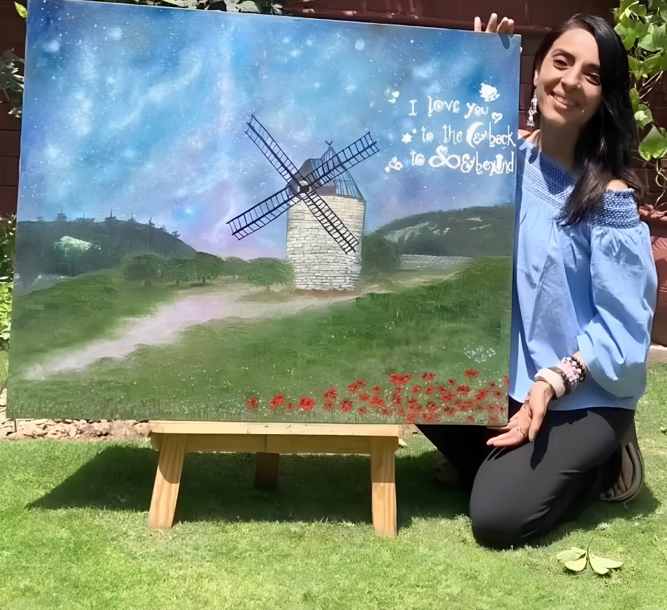 Vani Kaushal beside her large oil painting I Love You to the Moon and Back, to Infinity and Beyond.